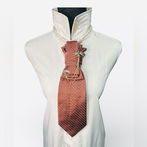 Elegant Striped Burnt Orange and Black Striped Necktie featuring Bird Brooch
